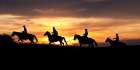 Sunset Cowboys Art Print