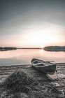 Boat on Shore at Sunset Art Print