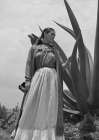 Frida Kahlo standing next to an agave plant Art Print