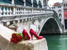Bunch of red roses and red high heel shoes, Rialto Bridge, Venice, Italy Art Print