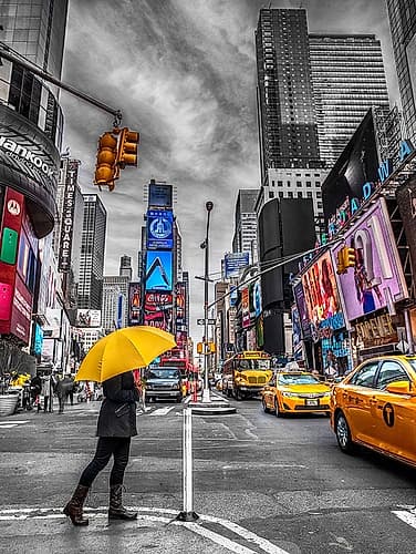 Man with yellow umbrella at Times square, New York Art Print