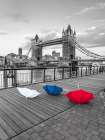 Colorful umbrellas on promenade near Tower bridge, London, UK Art Print