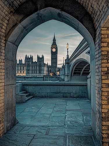 View of Westminster Abby and Big Ben from Thames promenade arch, London, UK Art Print