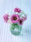 Colorful Lisianthus flowers in glass bottle Art Print