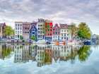 Amsterdam townhouses by the canal Art Print