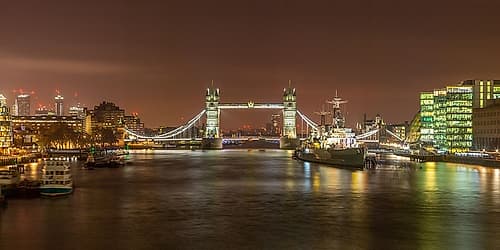 Tower Bridge and HMS Belfast at night Art Print