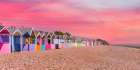 Beach huts as sunset Art Print