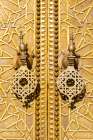 Ornate Golden Door With Decorative Knockers. Fez, Fez-Meknes, Northern Inland Morocco Art Print