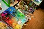 Colorful Painters Palette With Brushes And Mixed Vibrant Paints In An Art Studio. Shanghai, China Art Print