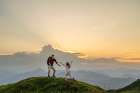 Father Enjoying And Playing With Daughter On Mountain At Sunrise Under Clear Sky Art Print