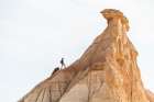 Trekking With Backpack At Sunrise In Bardenas Reales Desert Landscape Art Print