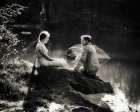 1930S Romantic Couple Sitting On Boulder Beside Lake Art Print