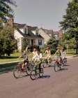 1960S 1970S Group Children Riding Bikes Down Suburban Street Art Print