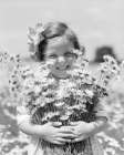 1930S Smiling Happy Little Girl Looking At Camera Holding Big Bunch Of Freshly Picked Flowers Art Print
