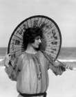 1920S Woman Standing On Beach Holding Oriental Umbrella Looking Off To Side Art Print