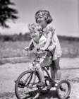 1930S Boy And Girl Brother Sister Riding Tandem On Tricycle Girl Steering On Back Of Trike Boy Fun Art Print