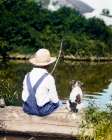 1920S 1930S Farm Boy Wearing Straw Hat And Overalls Sitting On Log With Spotted Dog Fishing In Pond Art Print