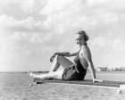1930S Smiling Woman In Bathing Suit Sitting On Edge Of Diving Board Over Water Looking At Camera Art Print