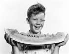 1940S 1950S Smiling Boy Holding Eating Large Slice Of Watermelon Art Print