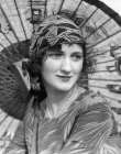 1920S Portrait Of A Woman In Front Of A Japanese Parasol Wearing Pearls And A Silk Print Headband Art Print