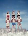 1950S Three Teenage Couples Standing On Sand Dune Girls Sitting On Guys Shoulders Art Print