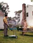 1960S Couple Suburban Backyard Man Grilling Woman Setting Picnic Table Art Print