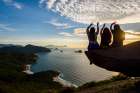 Three People Sitting On Rock At Sunset, Pedra Do Telegrafo, Rio De Janeiro, Brazil Art Print