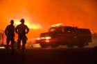 Firefighters Stand Watch As Fire Truck Passes While Jesusita Wildfire Burns In Santa California. Art Print