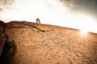A Climber Nears The Top Of A Route In Joshua Tree. Art Print