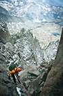 Woman Rock Climbing In Mountains, Rappelling Down Ledge. Art Print