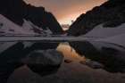 A Man Is Reflected At Sunset In Wedgemount Lake, Garibaldi Provincial Park, Canada. Art Print