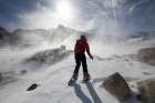 Hiker Is Surrounded By Blowing Snow In Alpine Basin Above Black Lake In Rocky Mountain Colorado. Art Print