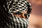 A Bedouin Man Wearing A Keffiyeh In Wadi Rum, Jordan. Art Print
