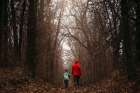 Father Son Walking Through Forest In Winter Art Print