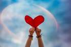 Hands Holding Red Heart In Sky With Rainbow Background Art Print