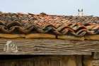 A Horse Peers Over A Rooftop In Santo Domingo De Silos, Spain. Art Print