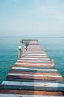 Wooden Pier Over Turquoise Sea At Klong Chao Beach, Koh Kood, Thailand Art Print by Agita Captures