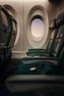 Soft Light Falls Across Empty Airplane Seats At The Window. Art Print
