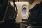 Soft Light Falls Across Empty Airplane Seats At The Window. Art Print