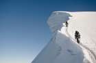 Two People In The Climbing A Snowed Peak In Cordillera Blanca, Peru. Art Print