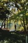 A Man Stands By The Hangzhou Lake Art Print