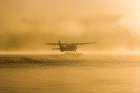 Bush Plane Takes Off From Naknek Lake In The Morning Fog, Katmai National Park, Alaska. Art Print