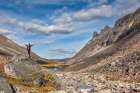 Hiker On Boulder In Arrigetch Creek, Arrigetch Peeks, Gates Of The Arctic National Park, Alaska. Art Print
