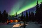 Northern Lights Over A Rustic Log Cabin In The Alaska Range, Interior, Alaska. Art Print