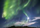 Man Watches Aurora Borealis, Also Called Northern Lights, Swirl Over Foothills Surrounding Alaska. Art Print