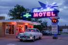 Tucumcari,New Mexico. Famous Blue Swallow Motel On Route 66 With Old Car Parked In Front. Art Print