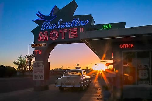 Tucumcari,New Mexico. Famous Blue Swallow Motel On Route 66, 1950S Car Parked In Front Of Lobby. Art Print