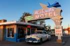 Tucumcari,New Mexico. Famous Blue Swallow Motel On Route 66, 1950S Car Parked In Front Of Lobby. Art Print