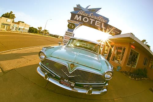 Tucumcari,New Mexico. Famous Blue Swallow Motel On Route 66 With Old Car Parked In Front. Art Print