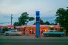 Tucumcari,New Mexico. Famous Blue Swallow Motel On Route 66 With Old Car Parked In Front. Art Print